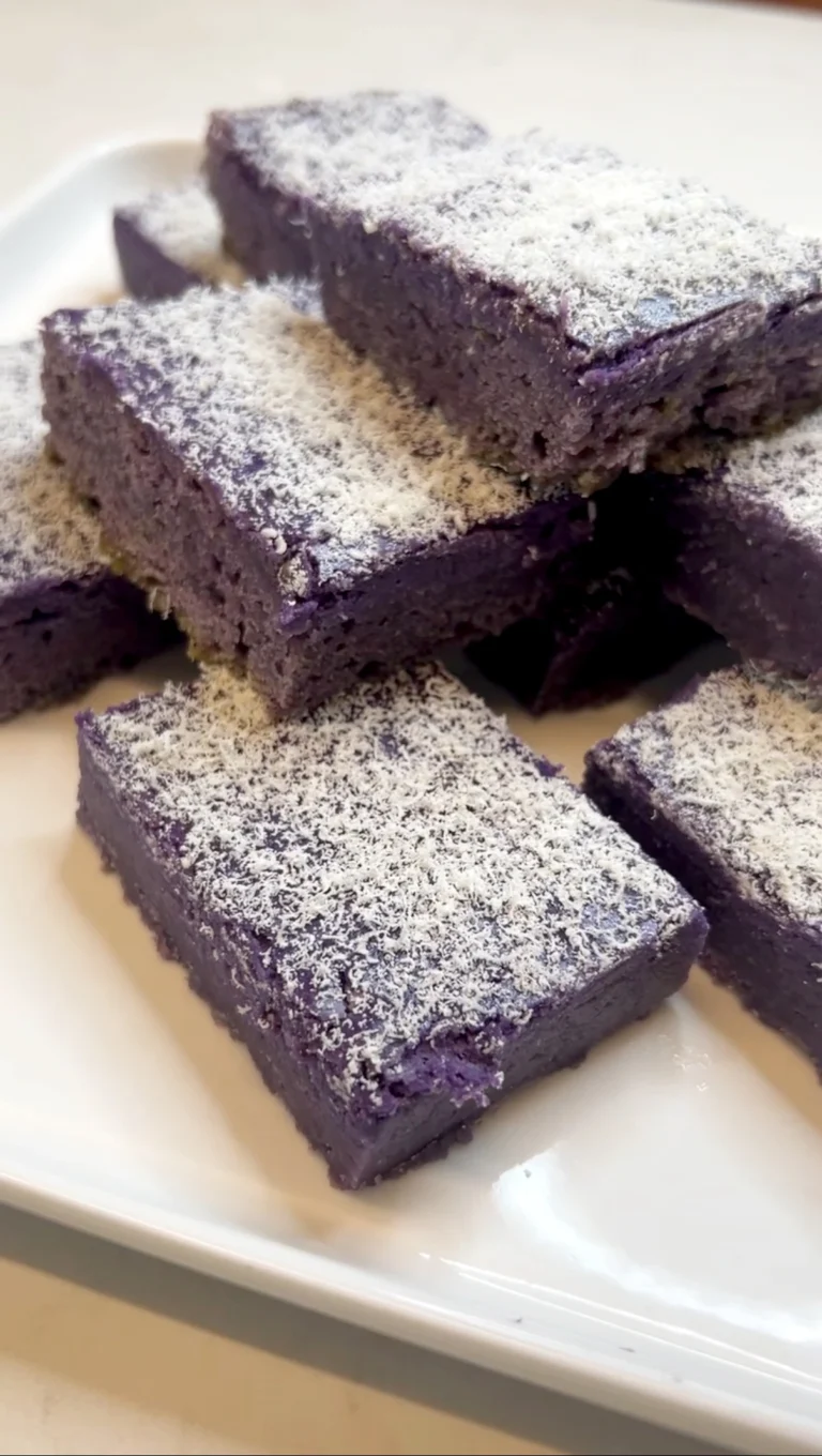 Fudgy ube slice with cheesecake swirl and white chocolate on top